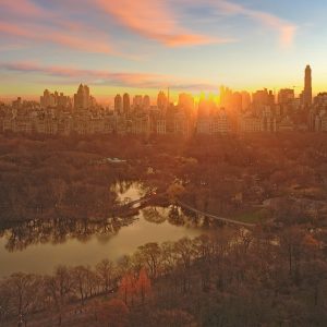 This photograph captures a vibrant, panoramic view of a sunrise behind the the east side of