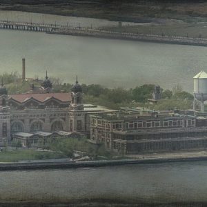 This is an old-style photograph of Ellis Island. It features the historic brick buildings situated