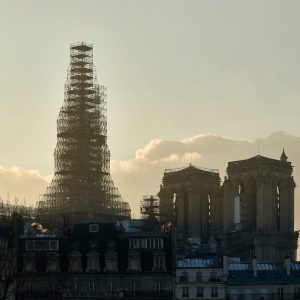 The Spire reappears on the Paris skyline, protected by the construction scaffolding.