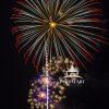 A huge shell shoots straight thru multiple starburst shells producing a spectacular composition.