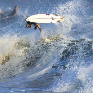 Surfer bails out in spectacular fashion grabbing plenty of air.