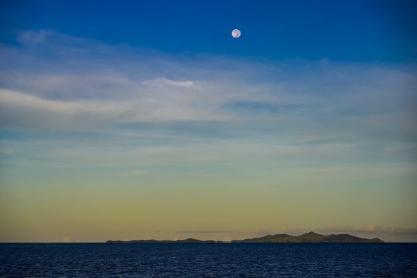 "Moonlit Tranquility Near Yakuilau" presents an enchanting glimpse into the serene beauty of a