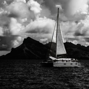 "Dance of Light and Sail" is a captivating black and white photograph that artfully captures the