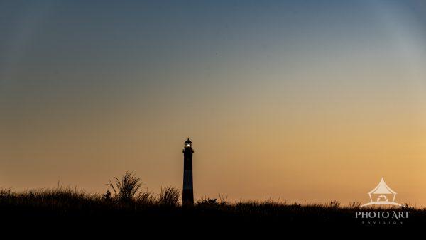 Captured during a serene sunrise on Fire Island, New York, this photograph presents the Fire Island