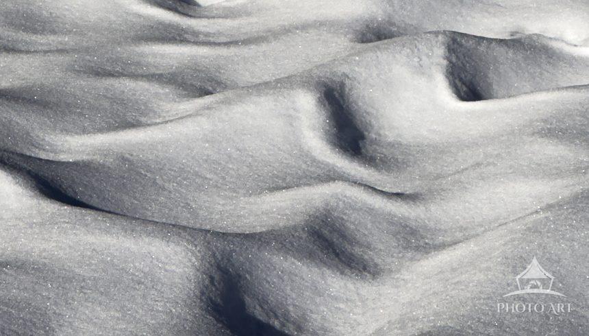 In the dead of winter, the wind sculpts the snow into mesmerizing patterns.