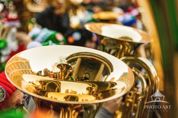 Reflections from the bell of a tuba at Tuba Christmas - an annual performance by tuba, sousaphone,