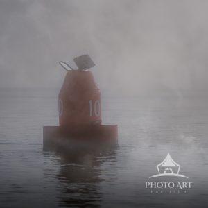 On a footy morning, the contrast of the red buoy in the fog caught my eye and makes for a very
