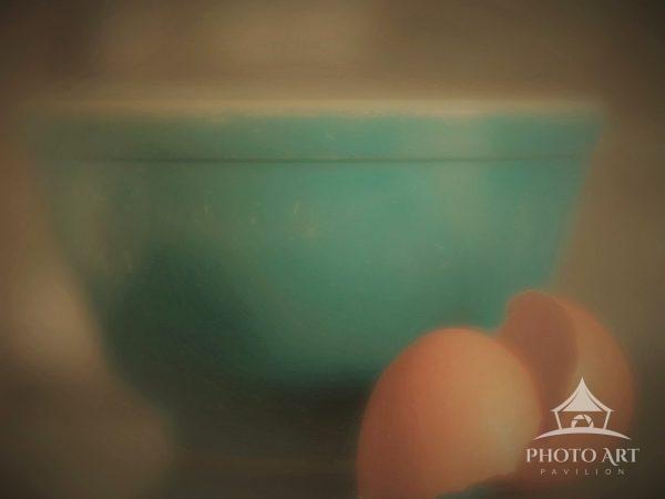 Blue bowl with a textured background, its glaze casting the light in soft painterly strokes. The