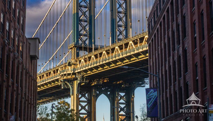 Manhattan Bridge photographed from DUMBO, Brooklyn, framed by historic brick warehouses and