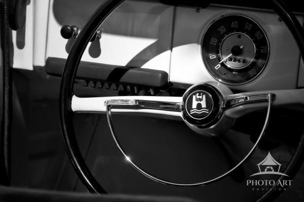 Chrome Reverie in Monochrome centers on the sleek form of a vintage steering wheel and its