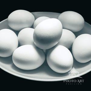 10 simple elegant eggs in an egg-shaped bowl.