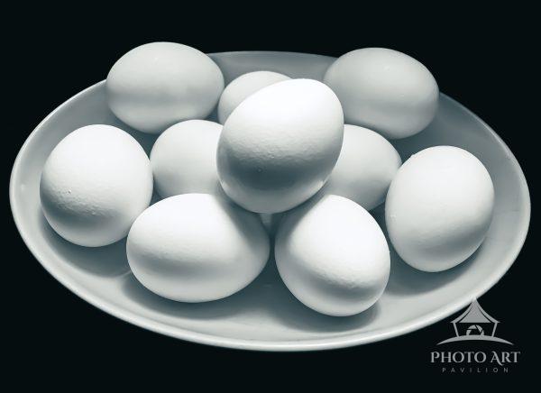 10 simple elegant eggs in an egg-shaped bowl.