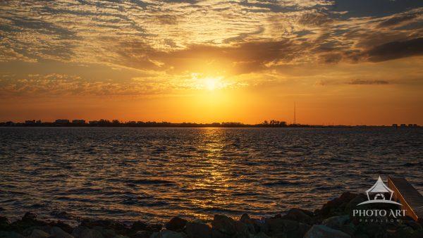 This image captures the breathtaking sunset on Bird Key Island, overlooking the Sarasota Shoreline