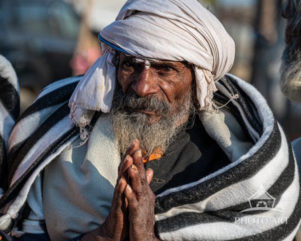 Sadhu paying his respects for the food and clothing given out at the Kumbh