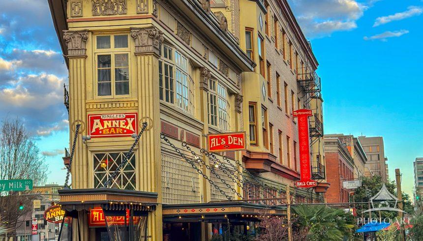 Historic Hal's Cafe occupies a corner building with outdoor patio seating, vintage signage and warm