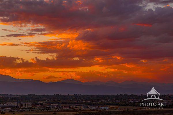 A stunning Rocky Mountain sunset as seen from Lafayette, Colorado, where warm evening light washes