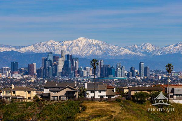 Downtown Los Angeles skyline with snow capped Mt. Baldy in the background
