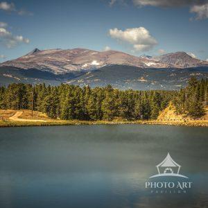 A Quite Colorado lake beneath a dramatic autumn sky. The Rockies at their finest