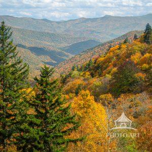 The scene captures the beauty and grandeur of autumn in the mountains at its seasonal peak