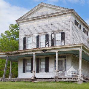 This unique Greek Revival Townhouse as Applied to a Farmhouse was built circa 1830, according to an
