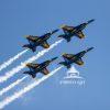Four of the US Navy Blue Angel planes take flight over the skies of Jones Beach on Long Island, NY