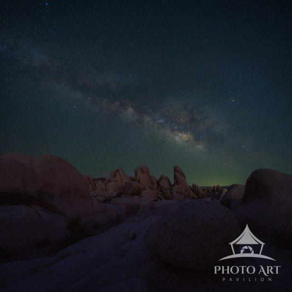 The Milky Way over rock formations at White Tank, Joshua Tree National Park, California.