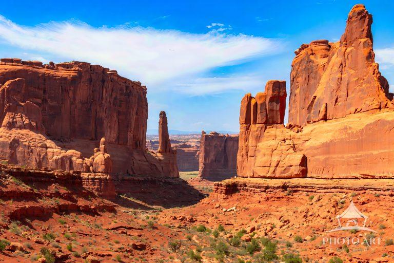 The hike features towering sandstone monoliths resembling city skyscrapers.
