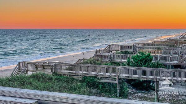 Boardwalks all in a row pointed to the beach on a quiet evening in North Topsail Beach, NC.