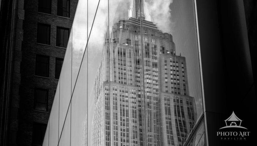 The Empire State Building reflected in a Manhattan window.