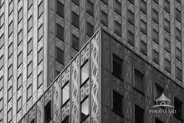 A detailed look at the embossed stainless-steel mid-century modern façade of the Socony-Mobil