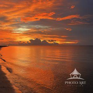 "Days End" captures a spectacular sunset over Dauphin Island, Alabama, where the sky transforms