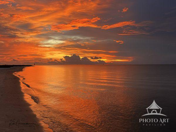 "Days End" captures a spectacular sunset over Dauphin Island, Alabama, where the sky transforms