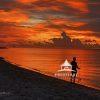 "Fisherman's Paradise" - In this luminous capture of a Surf Fisherman at Sunset, the ancient