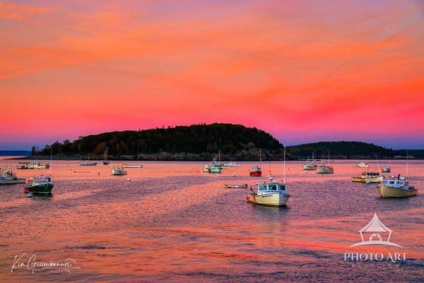 Bar Harbor Sunset captures the quintessential Maine maritime evening, where lobster boats rest upon