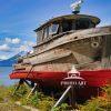 Interim captures the weathered dignity of a retired fishing vessel at rest along the shores of Icy