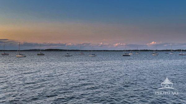 Sailboats moored for the evening on Lake Mendota as viewed from the Terrace at Memorial Union at