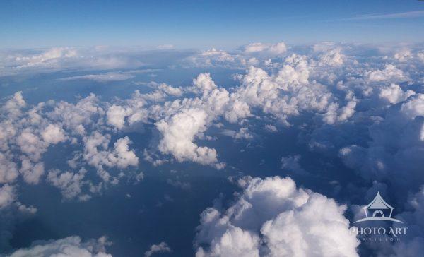 Viewing the awesomeness of the clouds while in flight.