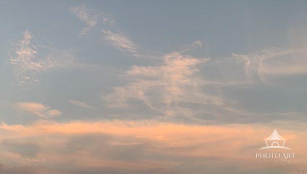 Clouds dancing in the desert sunset.